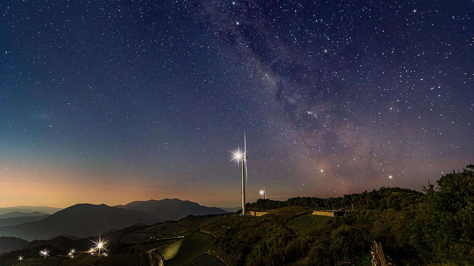 Anbandegi 02 with Milky Way and wind power generator visible's Night is<br>More Beautiful Than Its Day