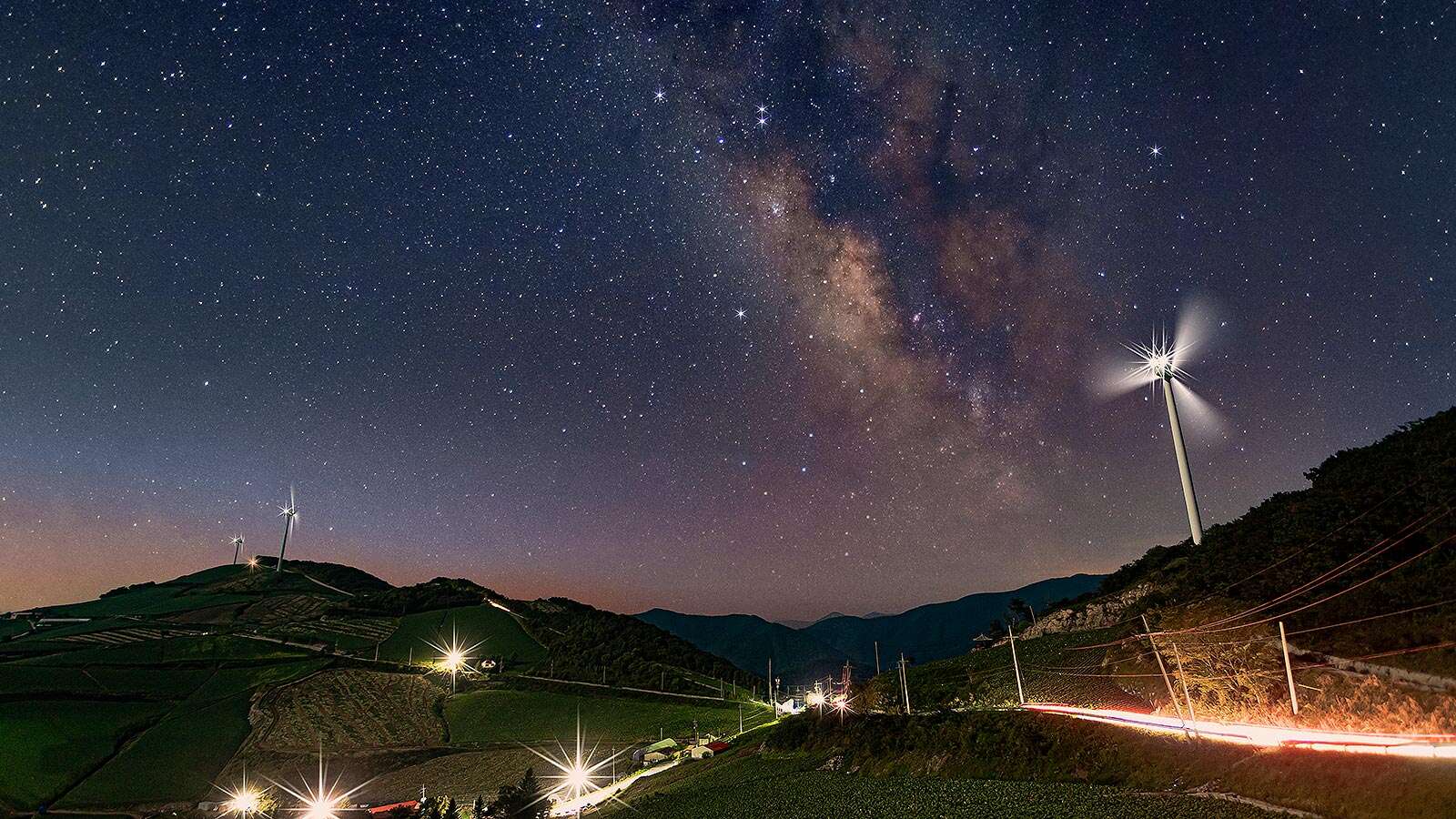 Anbandegi 01 with Milky Way and wind power generator visible's Night is<br>More Beautiful Than Its Day
