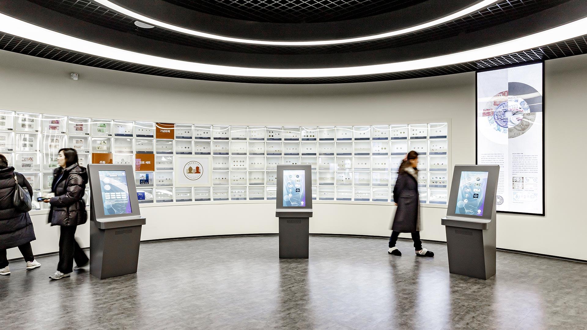 People viewing indoor exhibits at Gangneung Money Museum 01