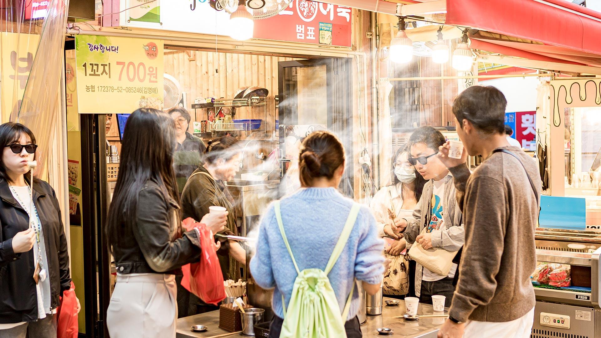 People enjoying snacks at Jungang Market